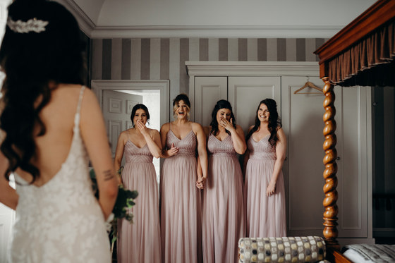 Bridesmaids react to brides dress
